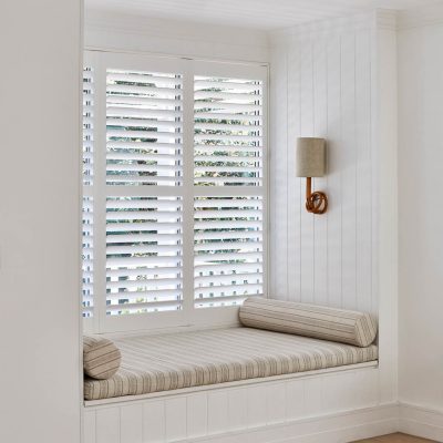 Premium Plantation Shutters 4 A window seat in the bay window of a residential home.